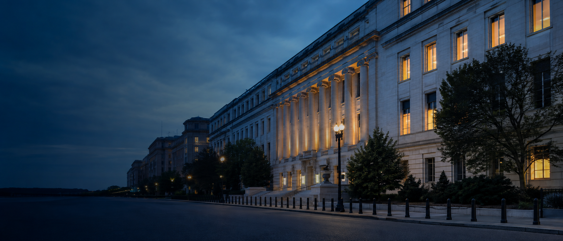 A federal tax office building at dusk, muted navy tones, editorial finance photography